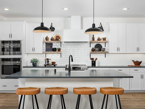Kitchen with pendant lighting and subway tile backsplash