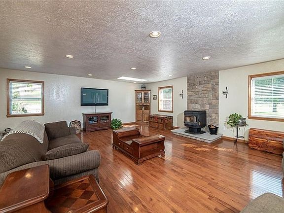 LIVING ROOM WITH PELLET STOVE.