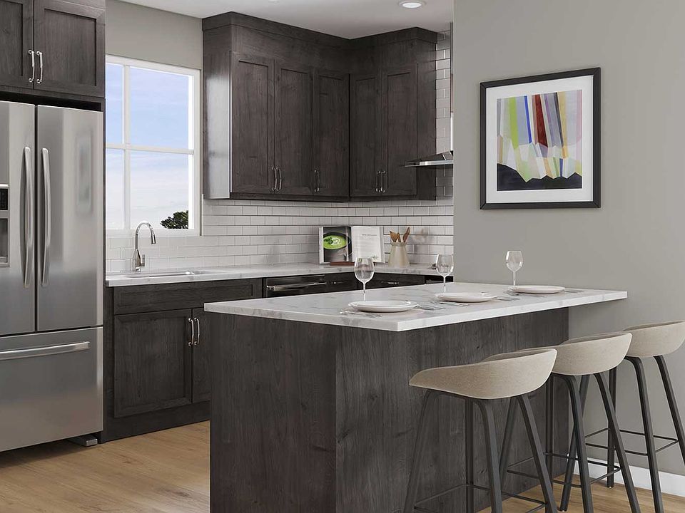 A rendering of the kitchen and eating bar of the Gillespie model in Seton by Brookfield Residential