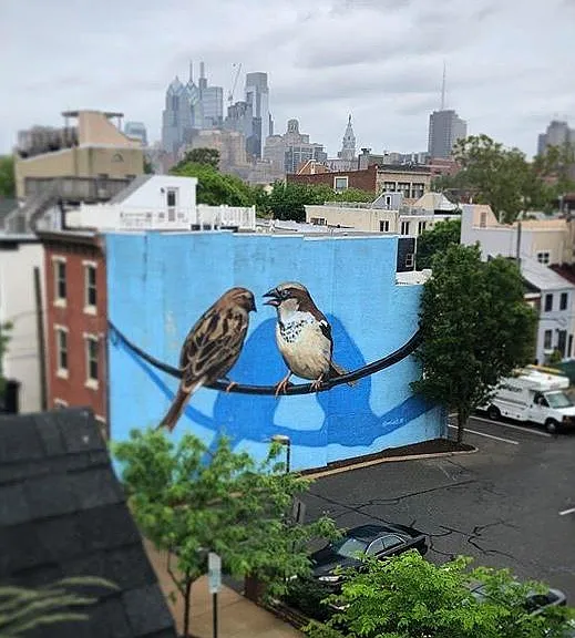Mural by VURT on the side of the building