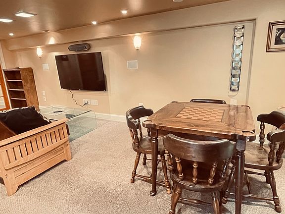 Dining area with table and chairs included.