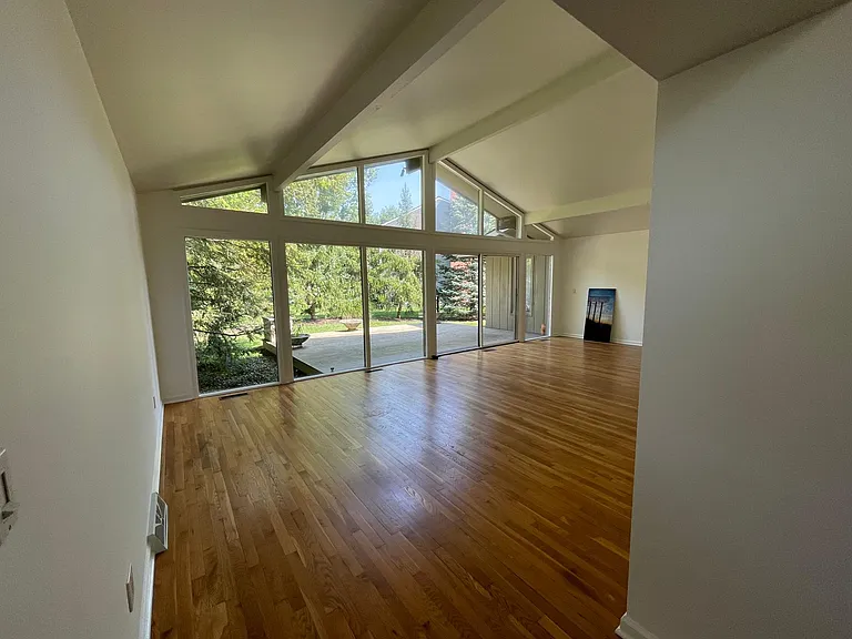Living room looking out to a second patio/balcony