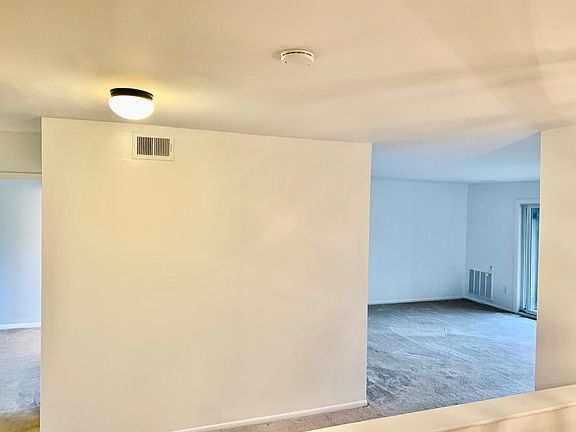 Big open living room with sliding door to the balcony