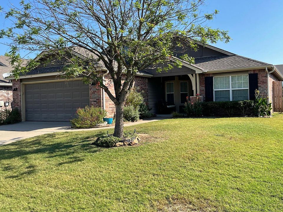 Covered front porch with porch swing; drip system for irrigation