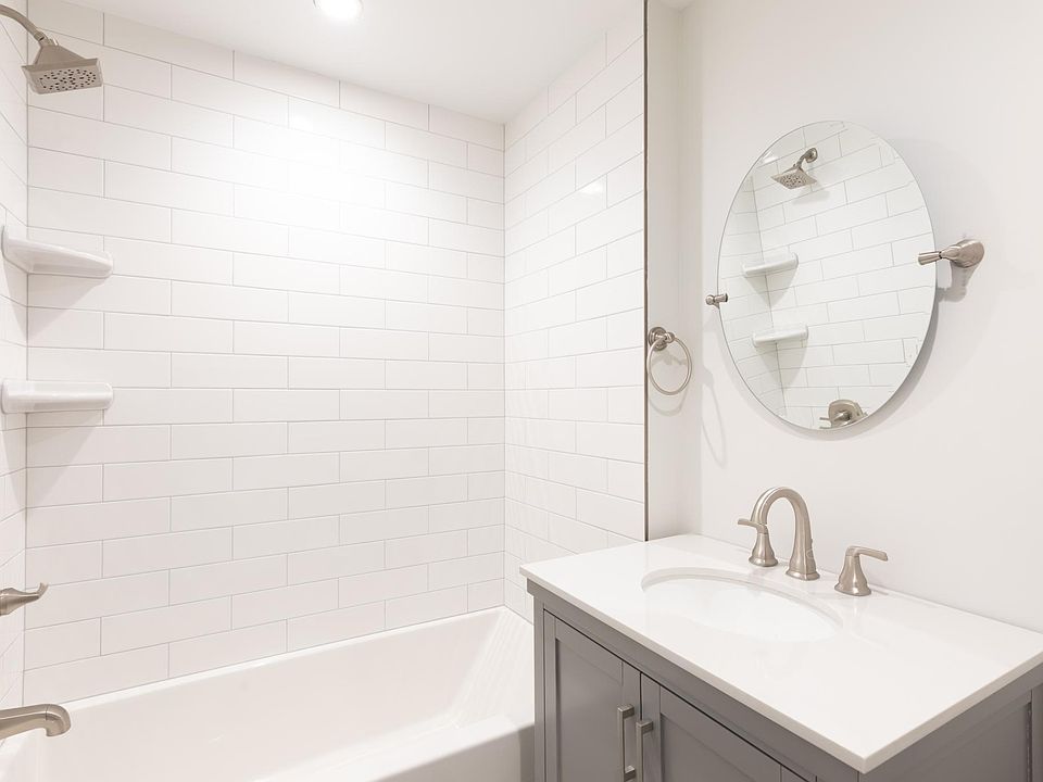Brand new bathroom with subway tile, vanity cabinet with lots of storage.