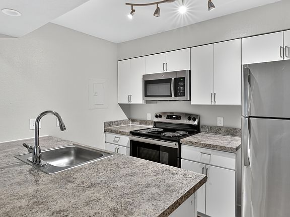 Cook, dine, and gather in a stylish kitchen space.