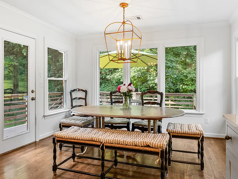 Lots of natural light in the dining room located off the kitchen with seating for 8.