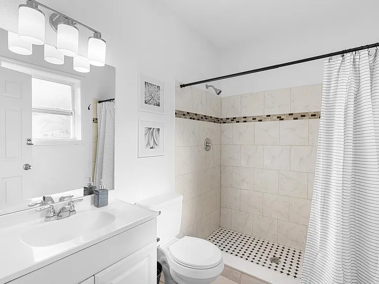 Clean shared bath with tiled shower & storage freshly updated, Sanford, FL