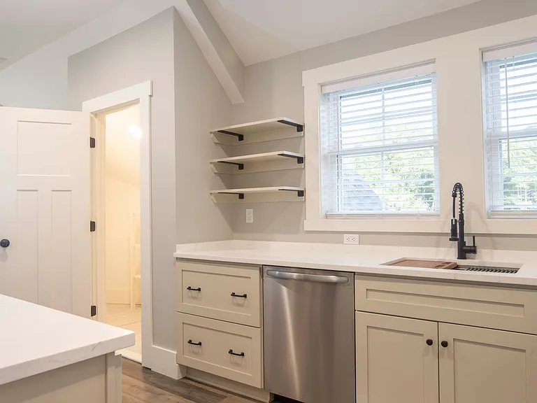 Kitchen with walk-in pantry.
