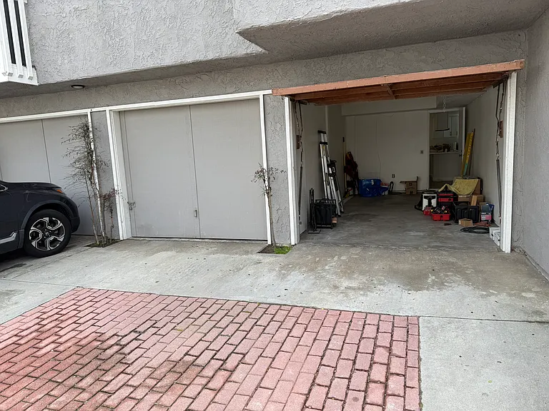Inside of garage with access to house.