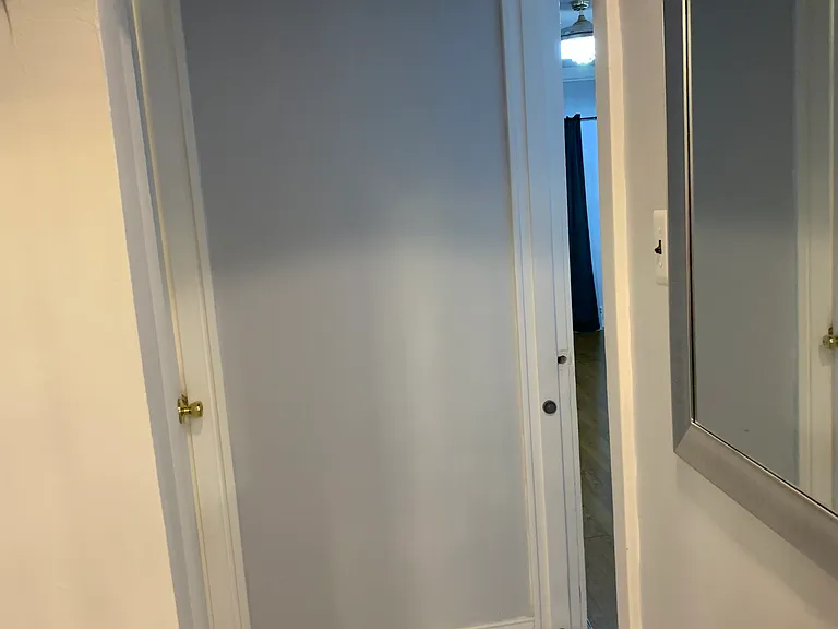 Hallway that leads to bedrooms, bathroom and kitchen.