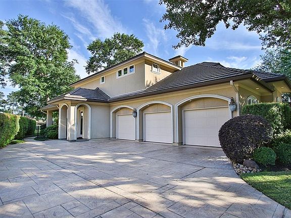The wide driveway leads to the 3 car garage from the side of the house, access to the mud room, and the gate to the back yard.