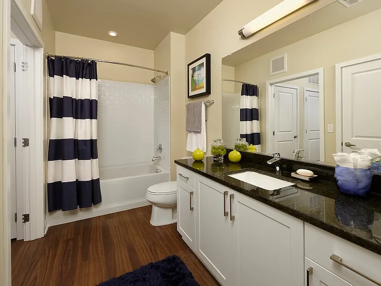 Hunt Valley - Finish Package I Bath with white shaker cabinetry, granite countertop and hard surface flooring