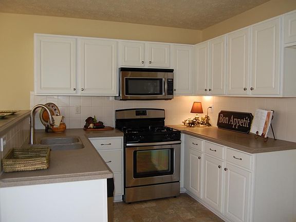 Updated kitchen with Corian counter tops and stainless appli