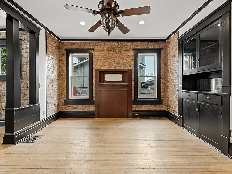Dining room with built in cabinet with storage.