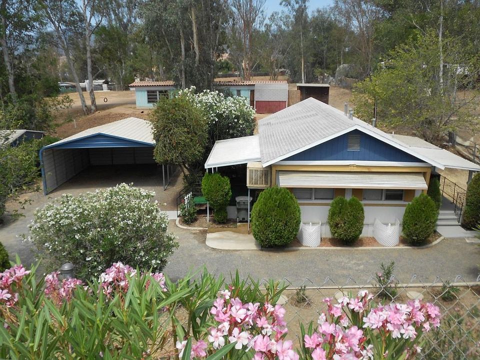 Exterior view including large double carport