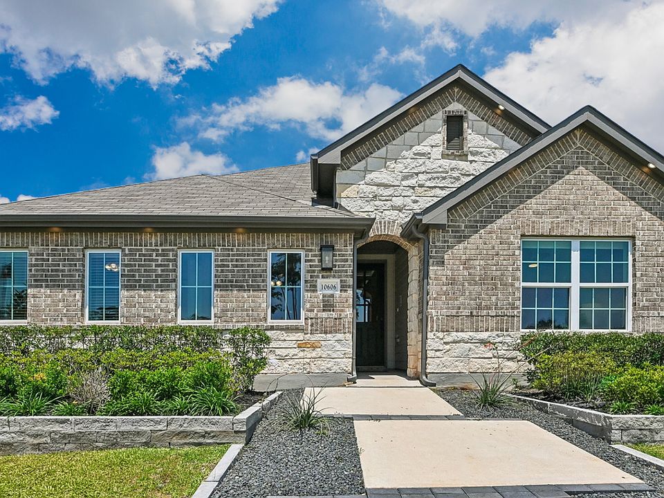Distinguished single-story home with refined brickwork and gable roofing in the exclusive Cielo encl