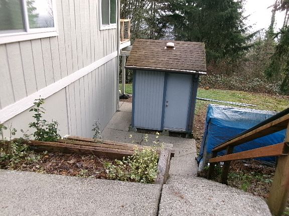 Storage shed south side of house