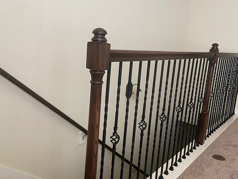 Elegant carpeted stairwell leads up to the dedicated media room.