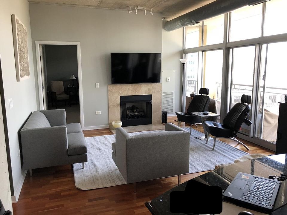 Spacious living room with gas fireplace.