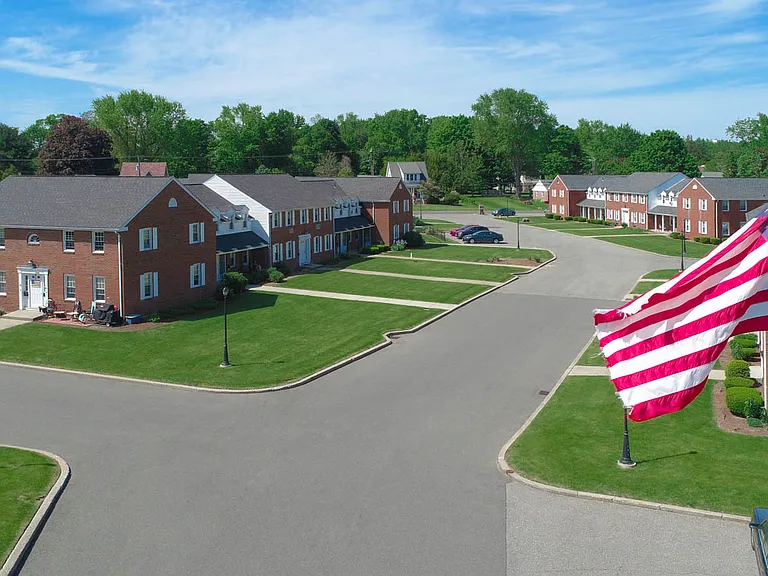 Timeless brick exterior townhouses blending classic charm with modern apartment living.
