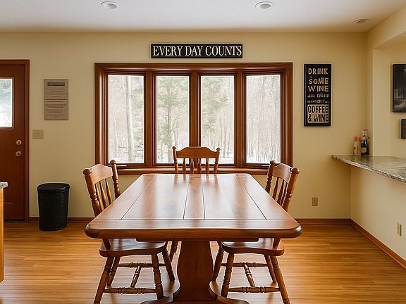 Sun-filled dining area with large windows and space for family meals or entertaining.