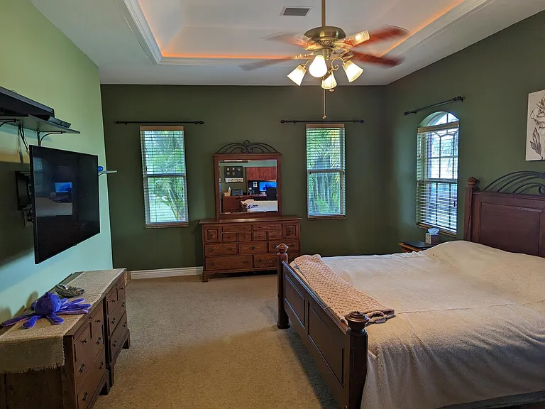 Master Suite. A 65-inch smart TV and soundbar are installed here for those who enjoy in-room entertainment.