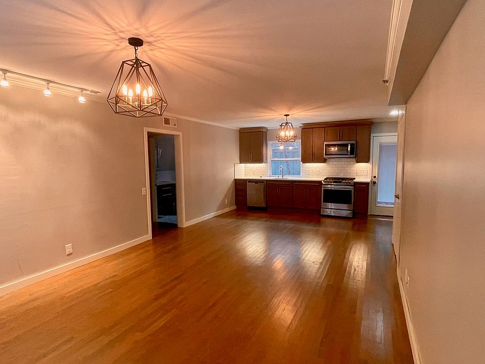 Open concept 2 bed, 2 bath with gleaming hardwood floors, updated kitchen and bathrooms and in-unit washer/dryer