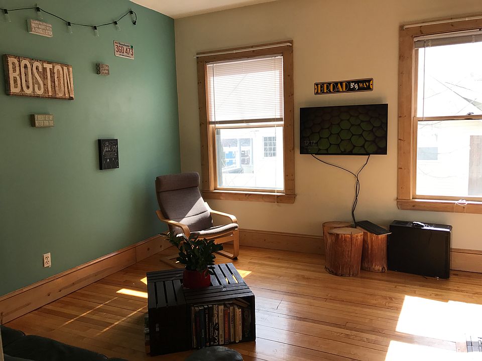 Living room with high ceilings and big windows