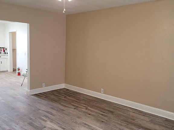 Living room with view to kitchen