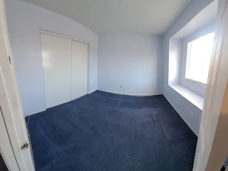 Upstairs Front Bed Room (Curved Due to Panoramic Shot)