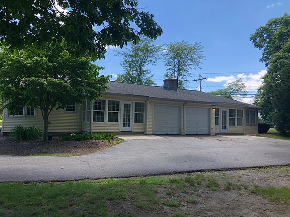 sunroom and storage garage in rear