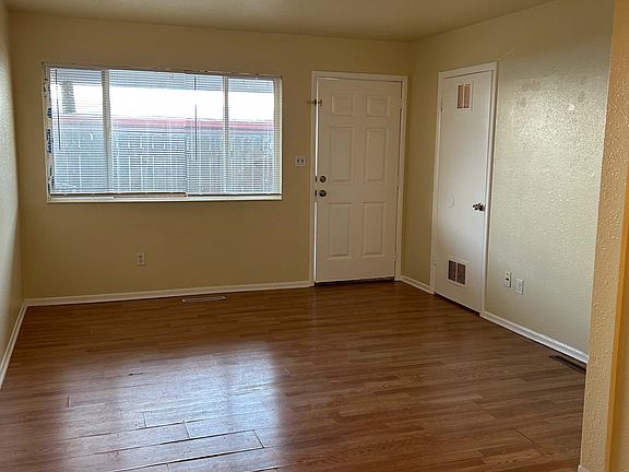 Living area, door on the right is the storage