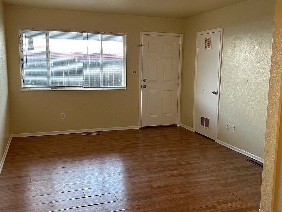 Living area, door on the right is the storage