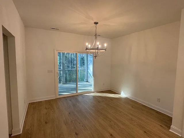 dining room overlooks screened porch and woods