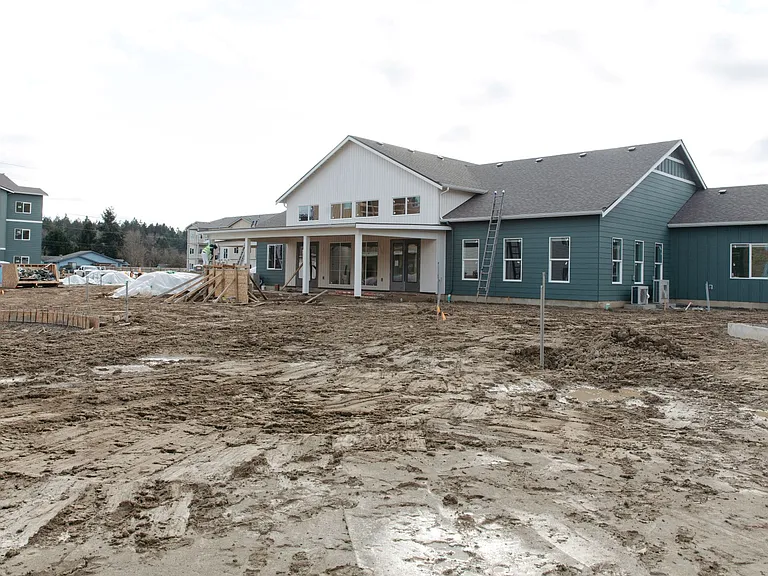 Future clubhouse at The Elowen in Lacey, WA. New community space taking shape alongside the apartment buildings on the active construction site.