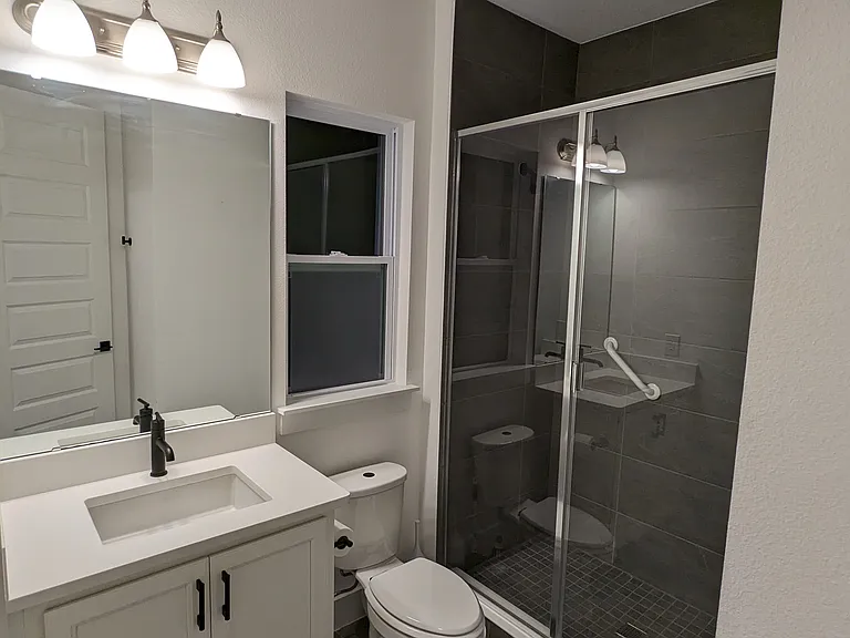 Ample Size Bath with Water-view over Frosted Glass Panel