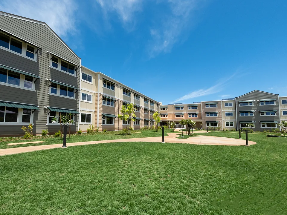 Modern apartment living with scenic courtyard views and lush garden pathways.
