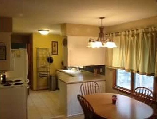 Kitchen and room for table