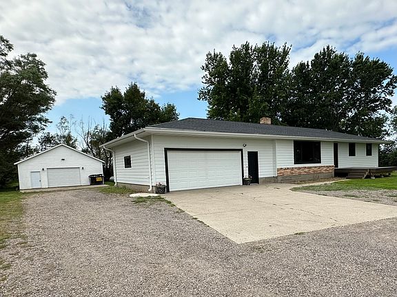 Front of home with additional 30'x40' shed/shop shown on the left.