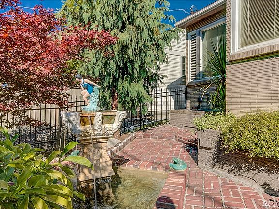 Mature landscaping with stunning water feature