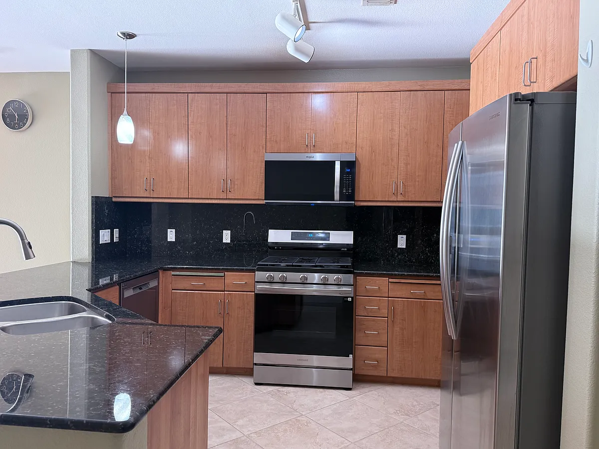 Kitchen with upgraded stainless steel appliances. - 5501 Demarcus Blvd