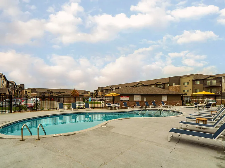 Enjoy sunny days poolside with plenty of lounge chairs and space to unwind.