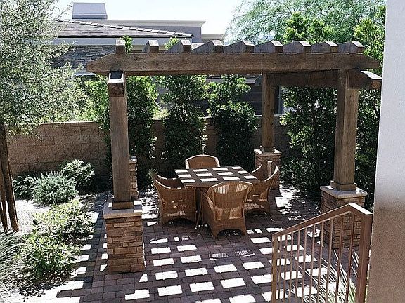 Pergola-covered outdoor sitting area