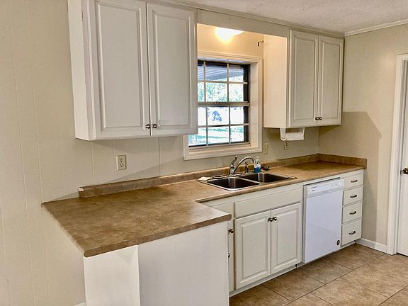 Kitchen with custom cabinets to ceiling.