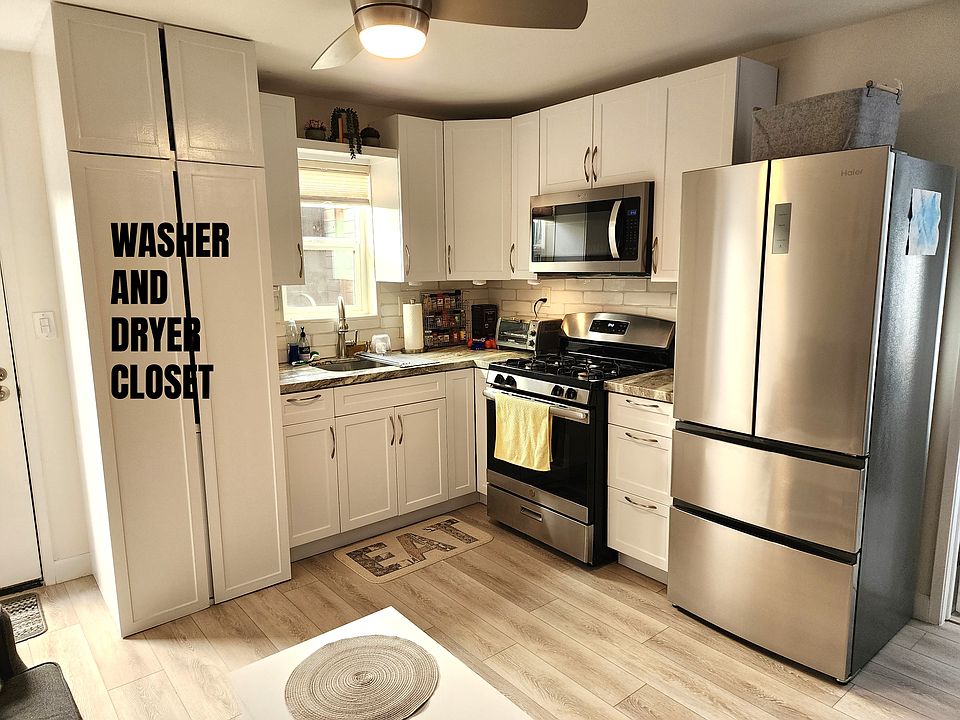 Kitchen - Washer and Dryer Closet with Storage Above (Washer/Dryer are inside)