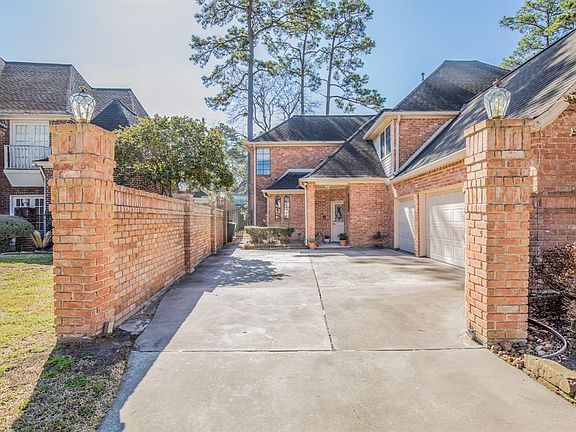 Long drive and 3-car garage allows for plenty of parking. Electric lanterns add evening ambiance and a back entrance to the kitchen is an easy grocery run.