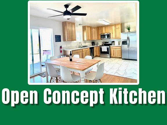 This open-concept kitchen and dining area is perfect for gatherings and casual meals. The kitchen is equipped with stainless steel appliances and ample storage, while the dining area offers a bright and airy space for family meals or entertaining friends.