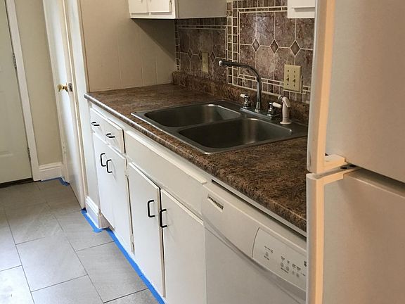Kitchen with dishwasher and refrigerator