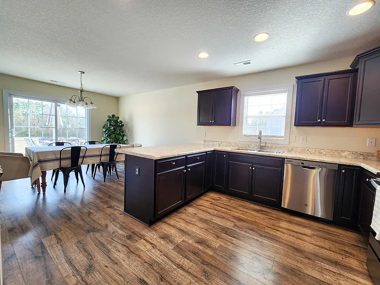 Fabulous kitchen with breakfast nook, stainless steel appliances and plenty of room to cook.